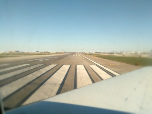 A plane on a runway about the take off for flight
