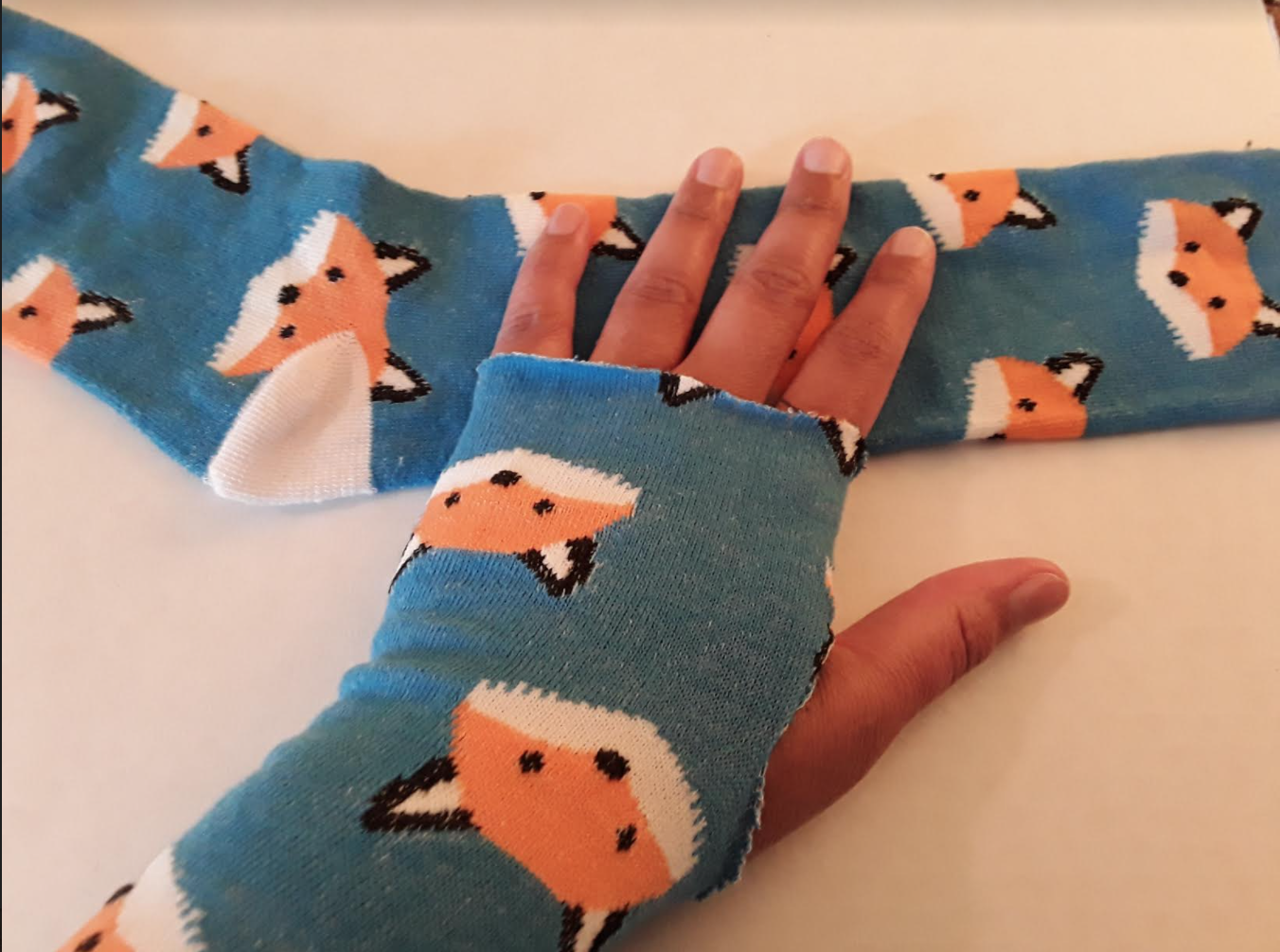 Socks with foxes on them cut into cloth wrist protectors