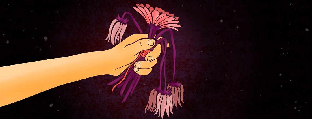A hand holds out a bouquet of wilted flowers