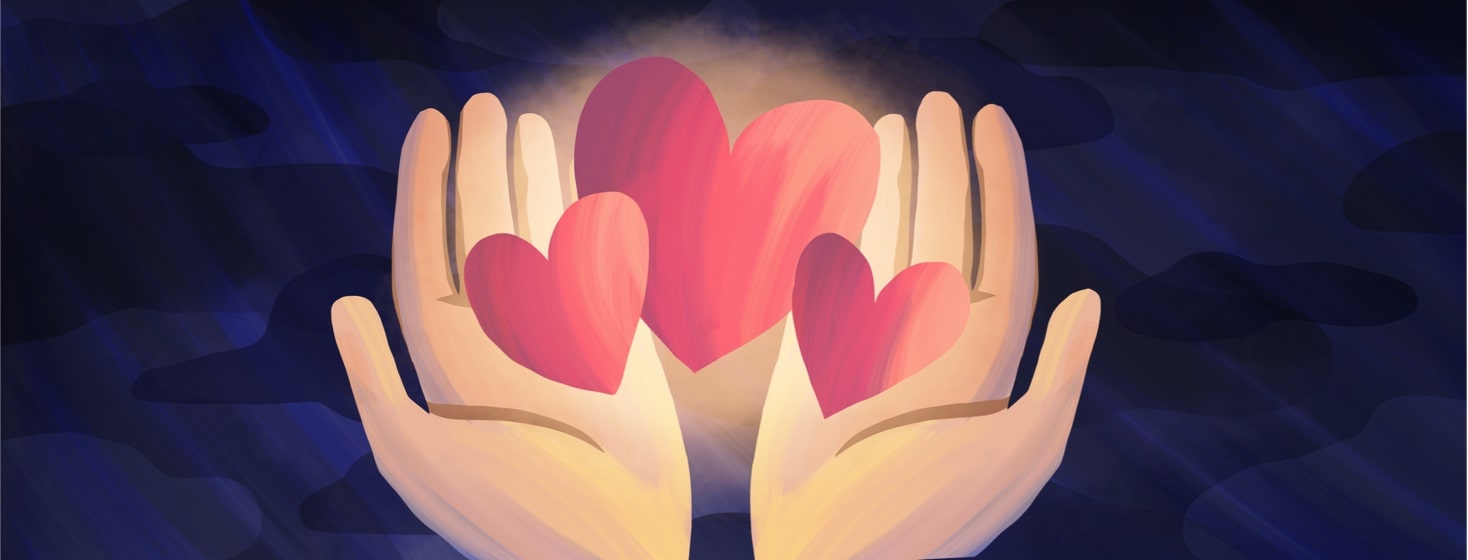 Two hands holding three glowing hearts
