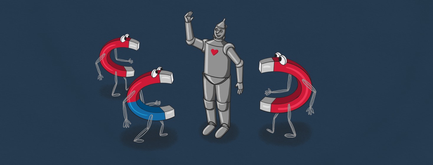 A tin man with a heart on his chest and a smile on his face, gesturing to welcome U-shaped magnets walking toward him.